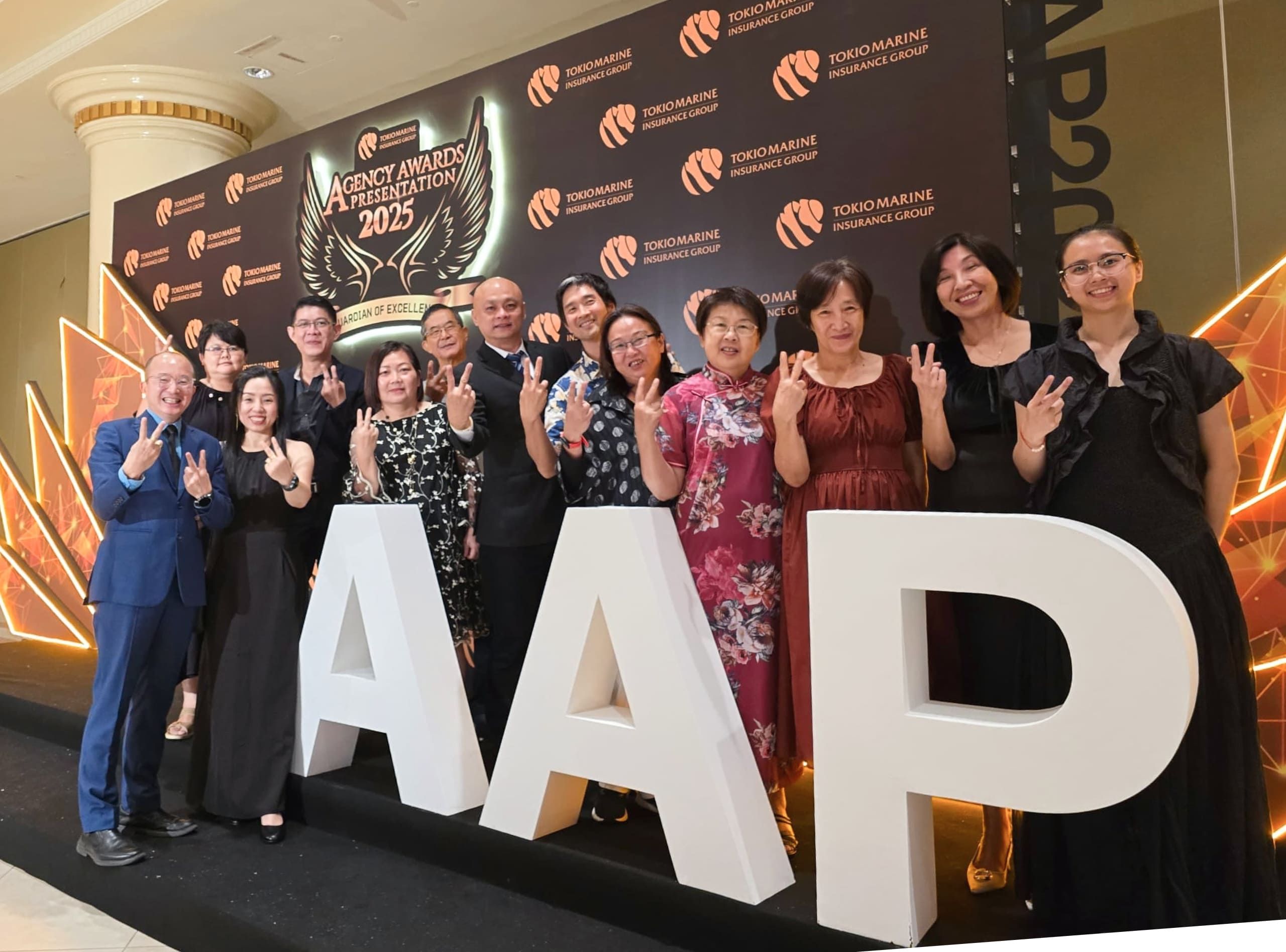 Group photo of staff members and agent at AAP event